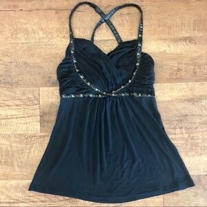 Black ttop with brass grommet and leather straps.  small